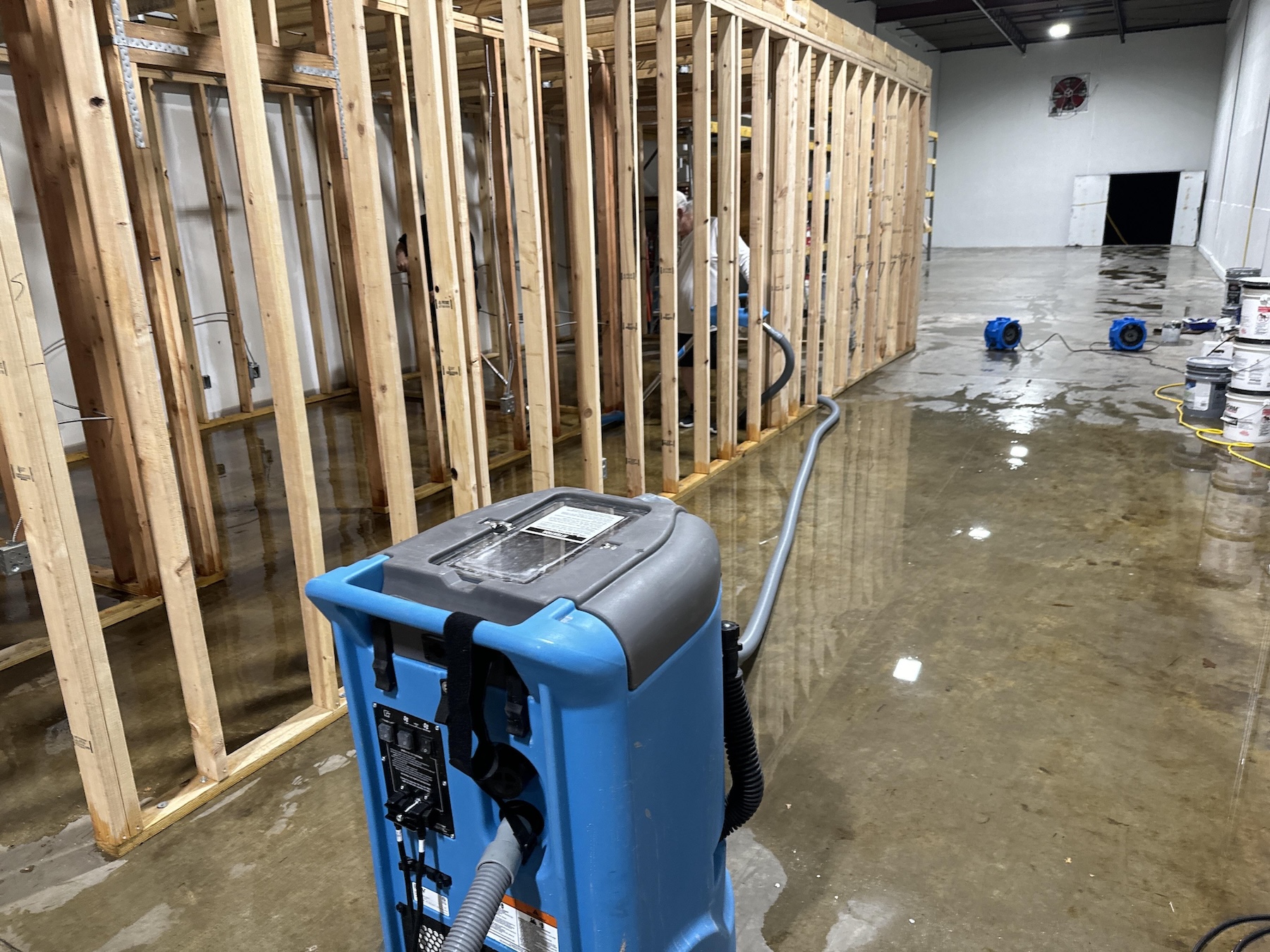Commercial framing exposed and saturated after storm intrusion in Chicago