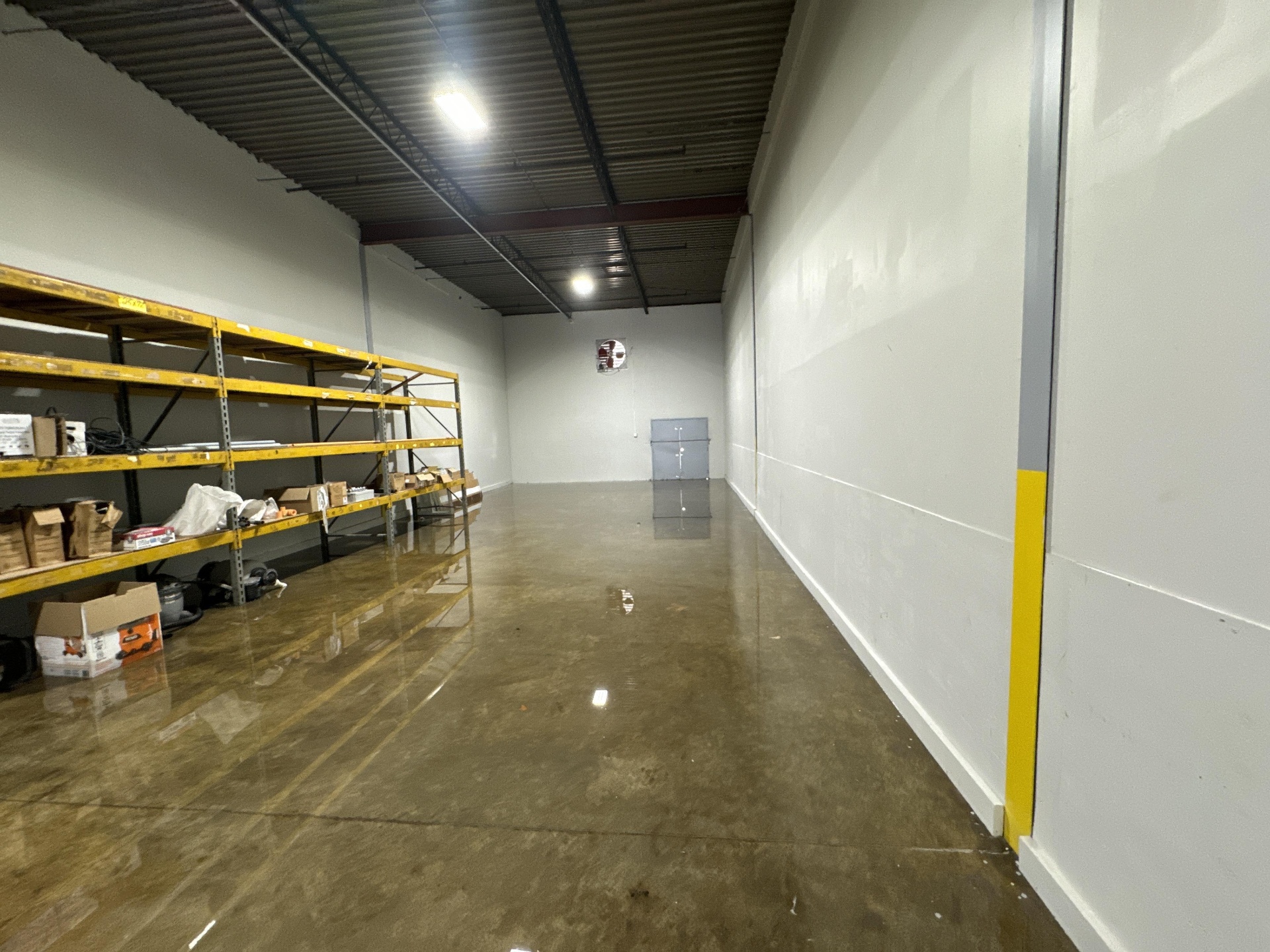 Flooded warehouse shelving with damaged inventory in Chicago